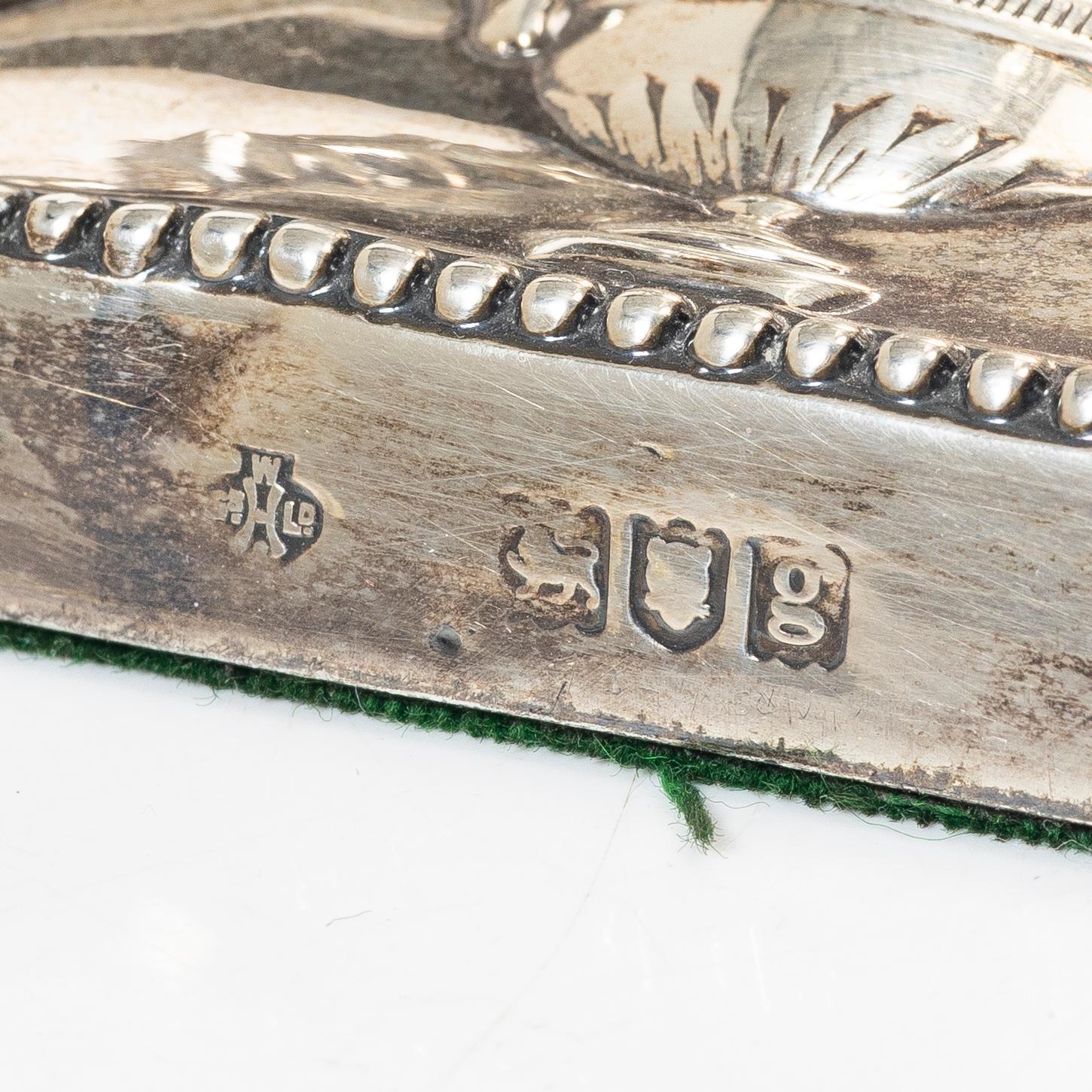 A pair of English silver candlesticks, mark of William Hutton & Sons Ltd, London 1902.