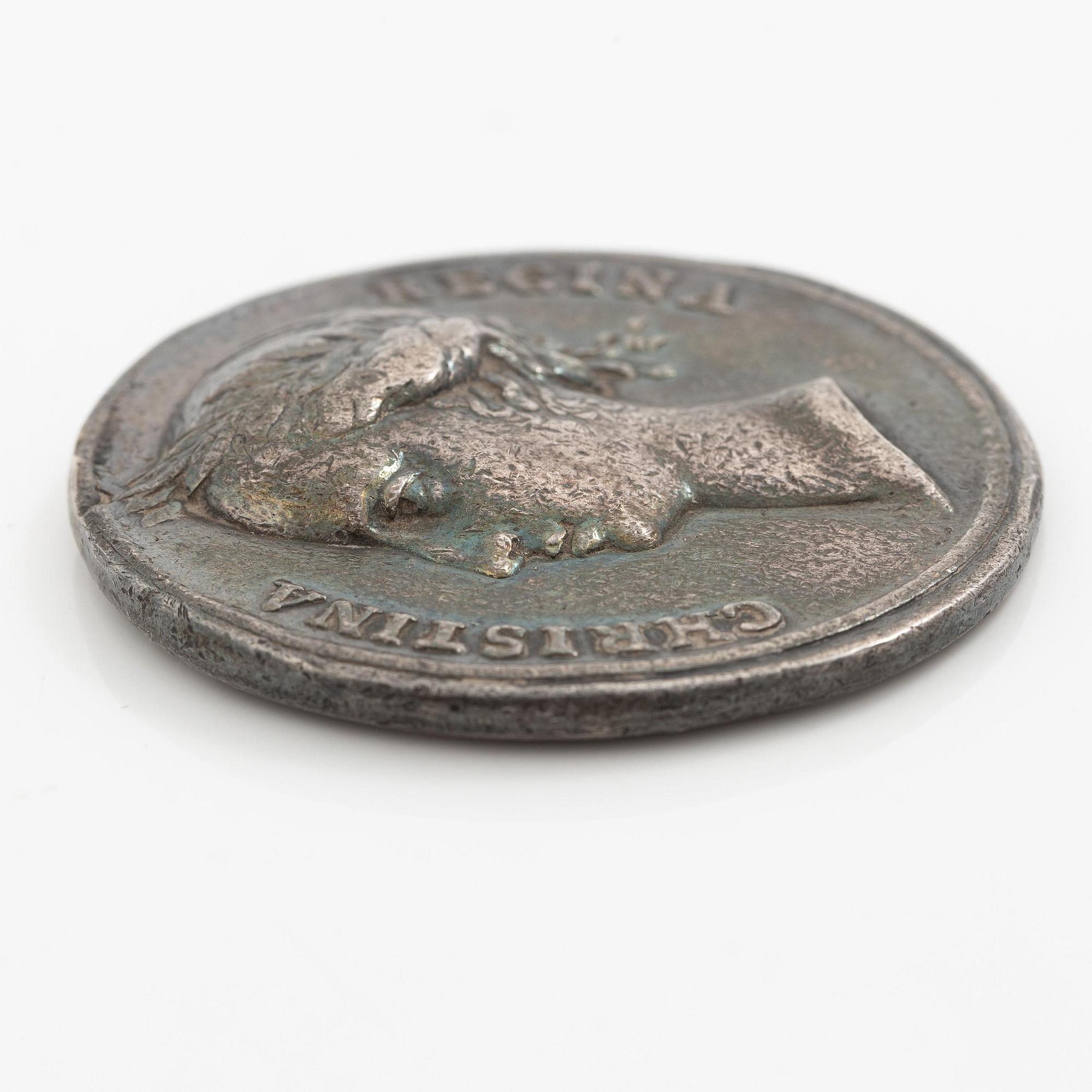 Kastpenning, Drottning Kristinas kröning 1650, av Erich Parise (medaljgravör under 1600-talets mitt).
