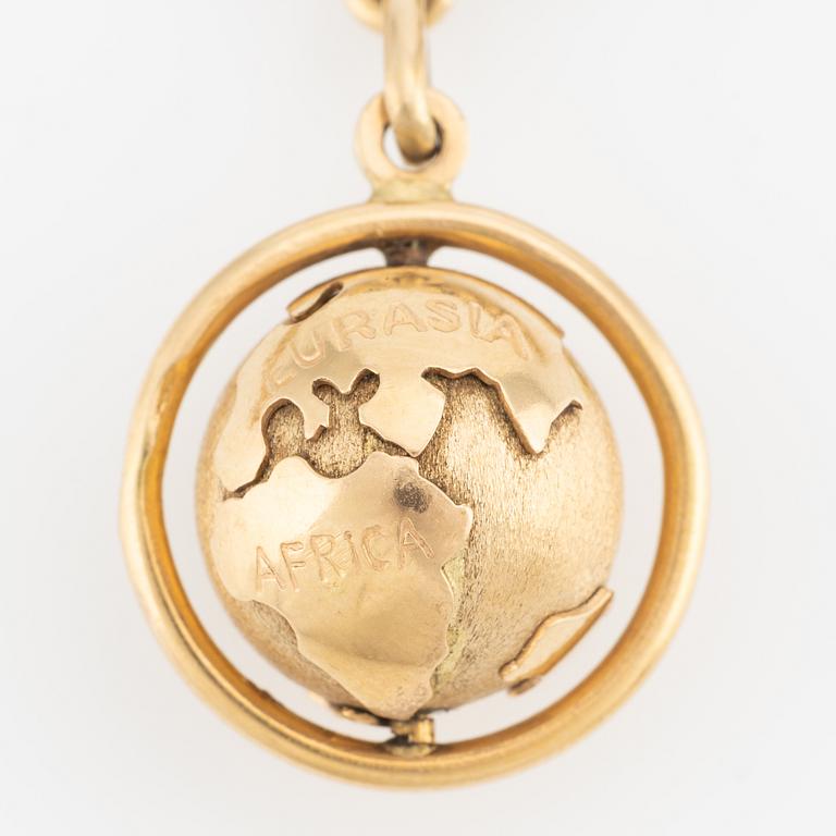 Bracelet with a charm in the shape of a globe, 18K gold, curb chain.