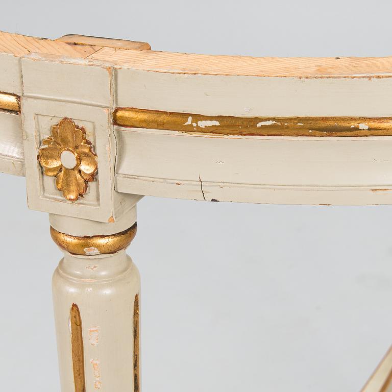 A Gustavian style sofa and table from early 20th century.