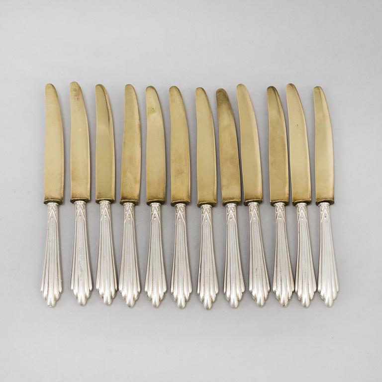 A set of twelve parcel-gilt silver fruite knives from the late 19th century.