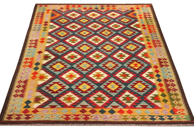 An Afghan Kelim carpet, c. 304 x 200 cm.