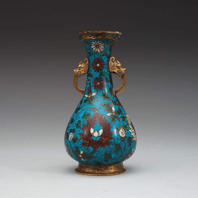 A cloisonné vase decorated with lotus-scrolls, and dragon- shaped gilded handles, Ming Dynasty (1368-1644).