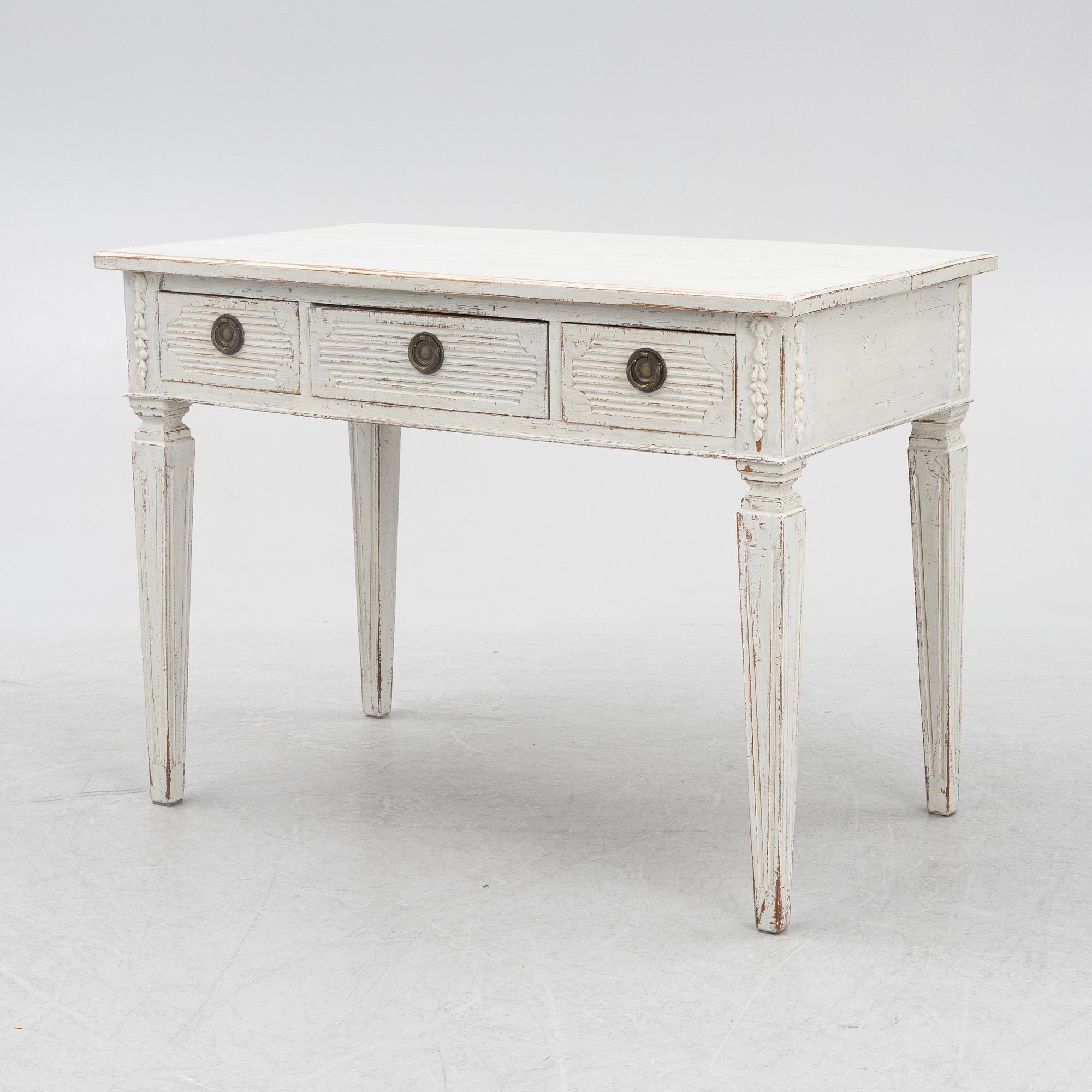 A late 19th century desk and an "Odenslunda" chair from IKEAs 18th century series.