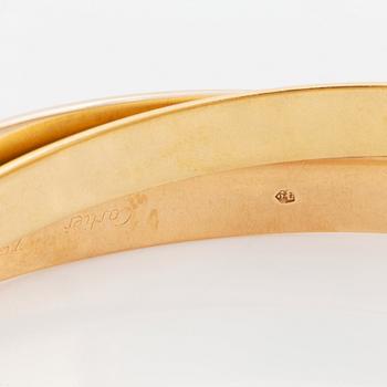 A Cartier "Trinity" bracelet in 18K gold.