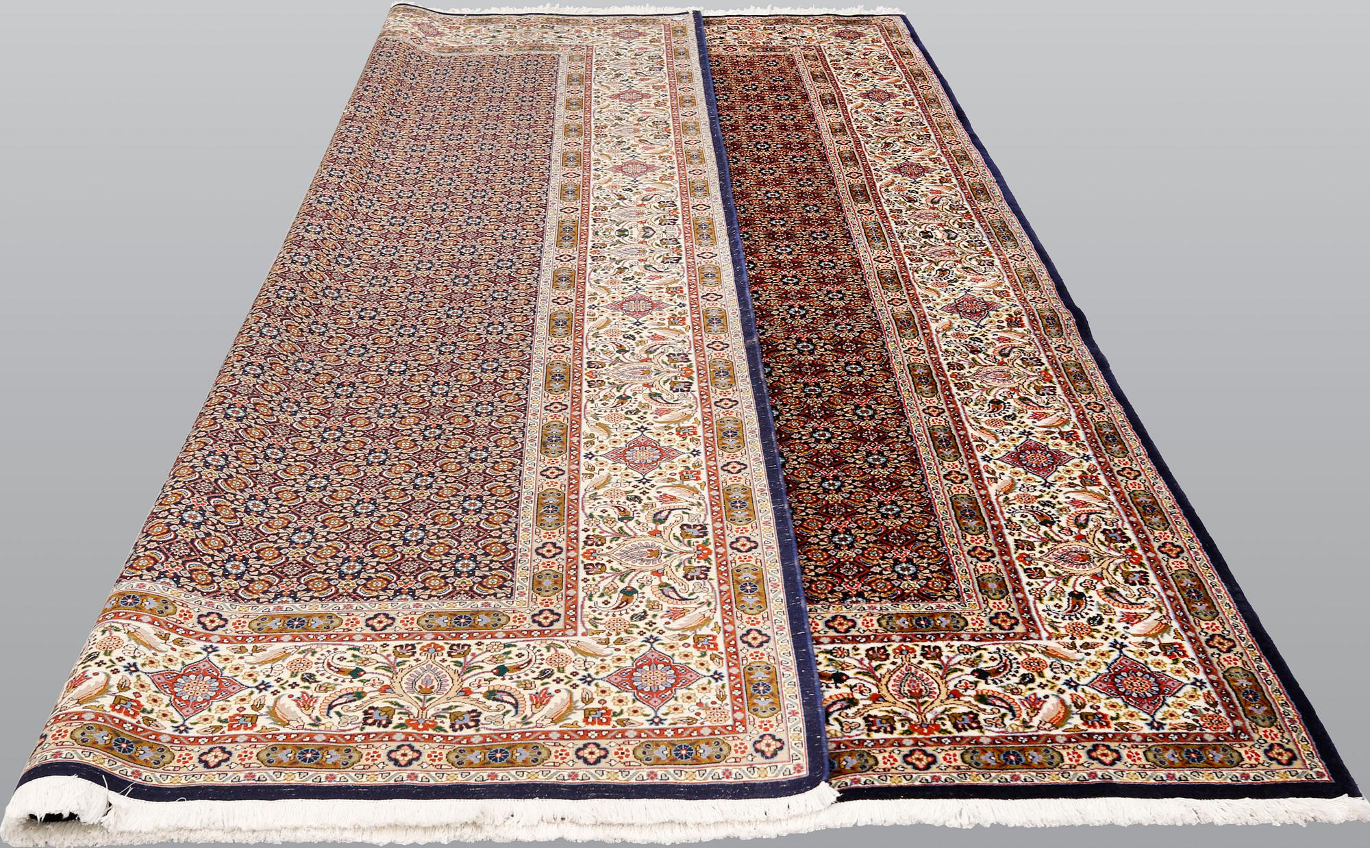 A Moud part silk carpet, signed, 335 x 250 cm.
