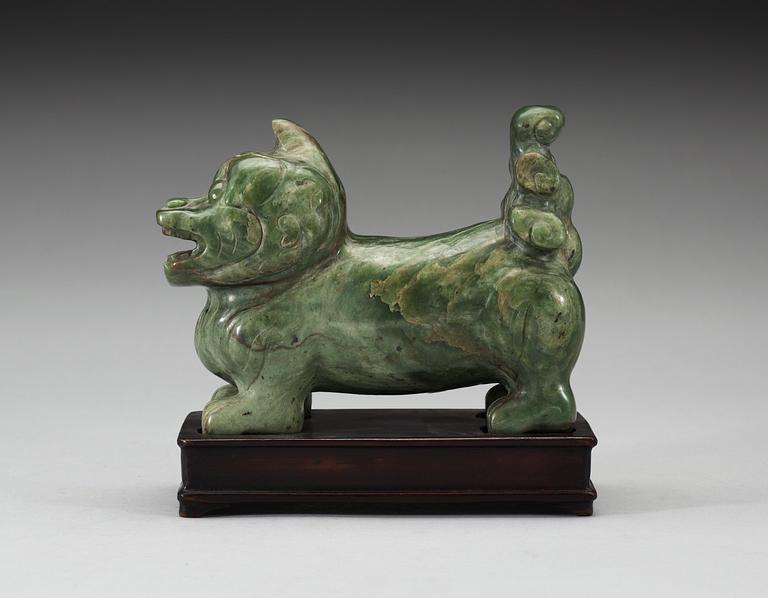 A nephrite figure of a Buddhist Lion, late Qing dynasty.