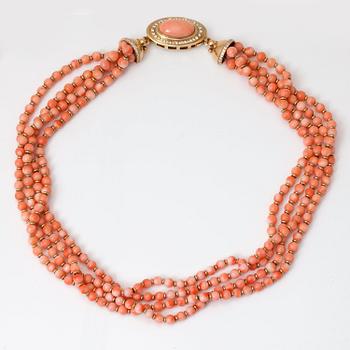 1061. A coral bead, 0.68ct brilliant-cut diamond and gold rondel necklace. Two additional coral drops included.