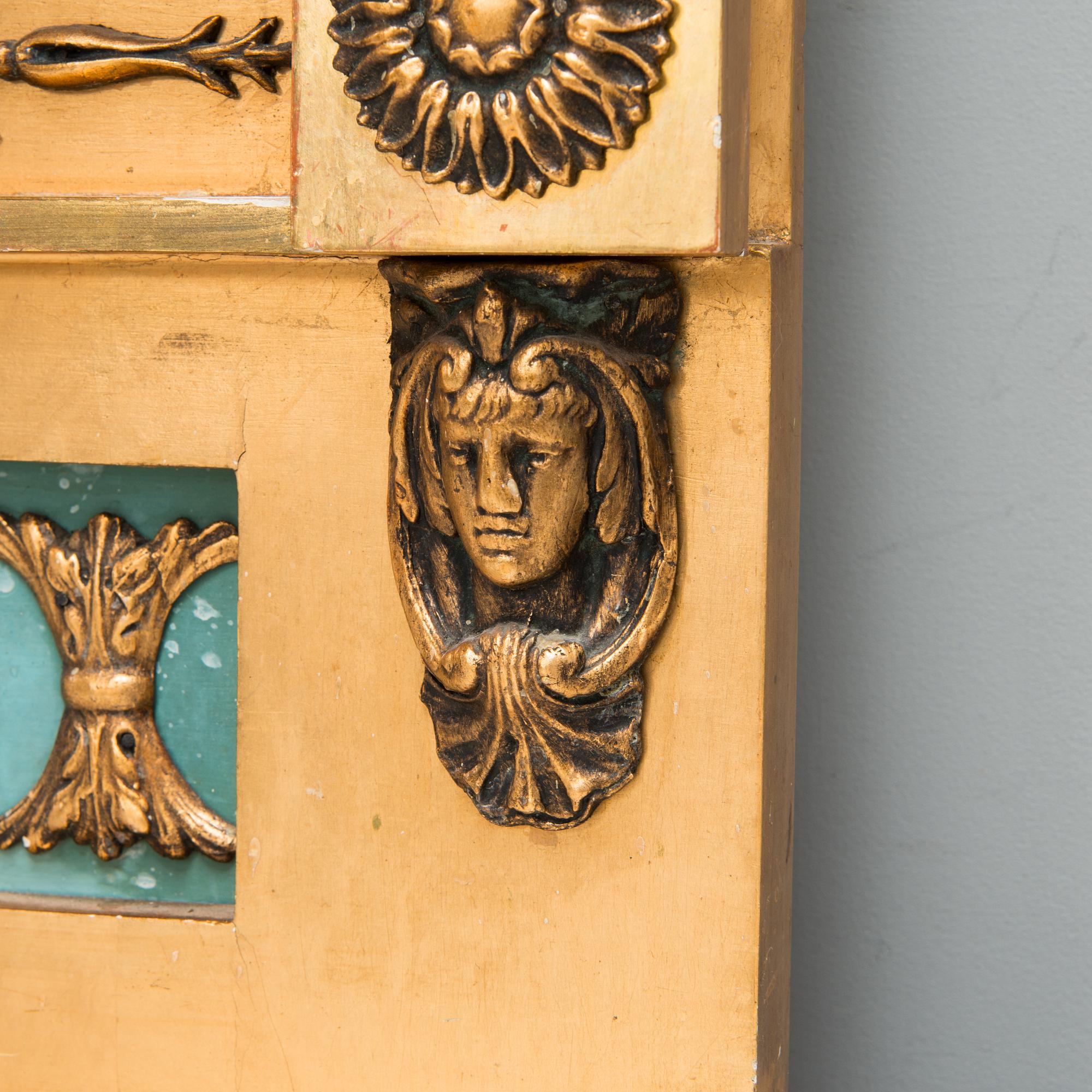 An early 20th century mirror with console table in late Gustavian style.