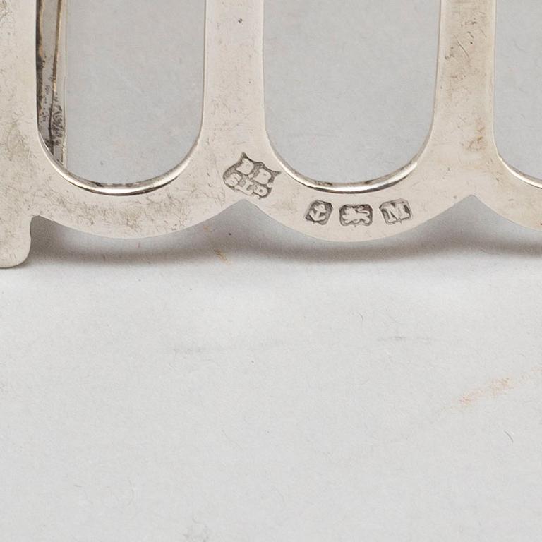 a set of four silver toastracks, Barker Brothers Birmingham 1936.