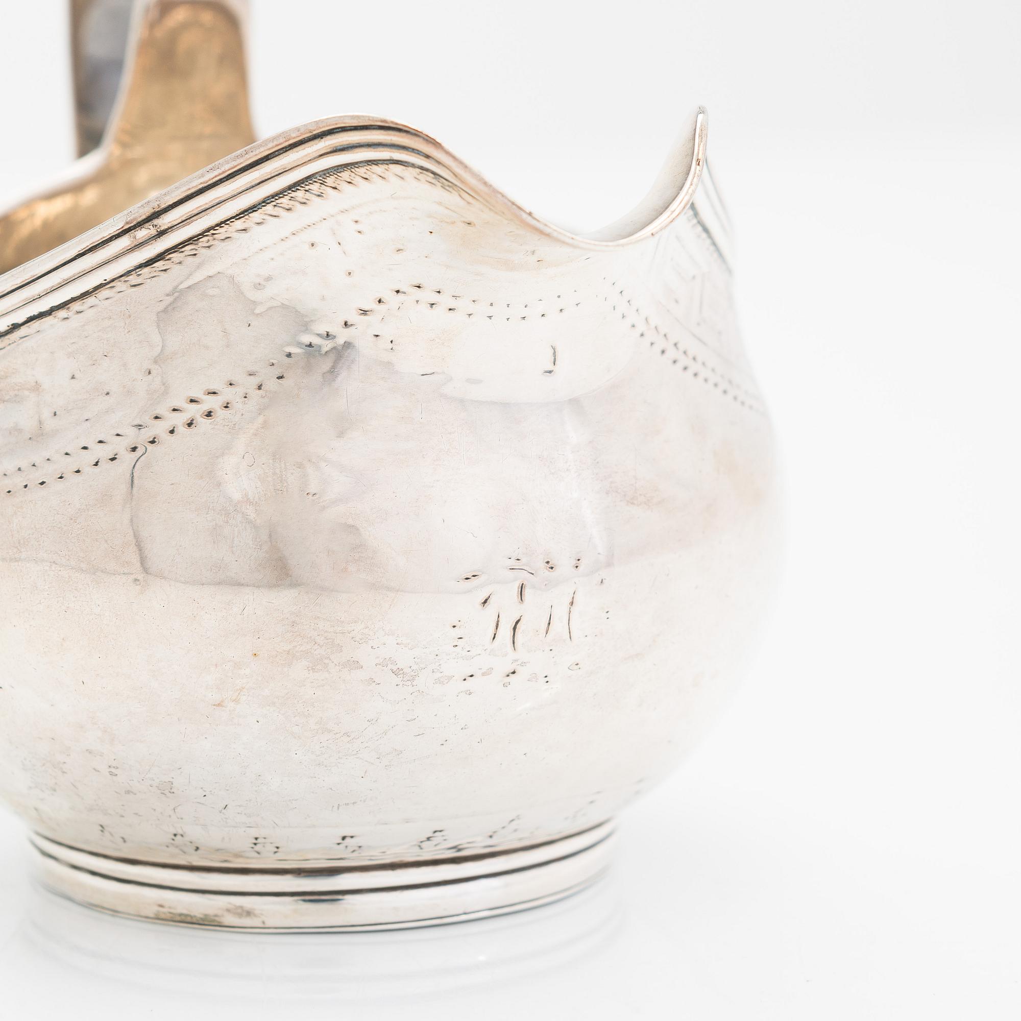 A Georgian sterling silver jug, late 18th century. Worn marks.