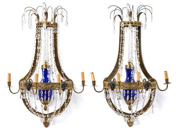 165. A pair of Russian Louis XVI-style  four-branch gilt bronze appliques, 19th century.