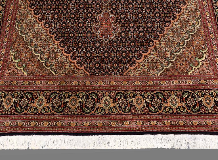 A RUG, Tabriz, part silk, so called 50 Radj, around 220 x 150 cm.