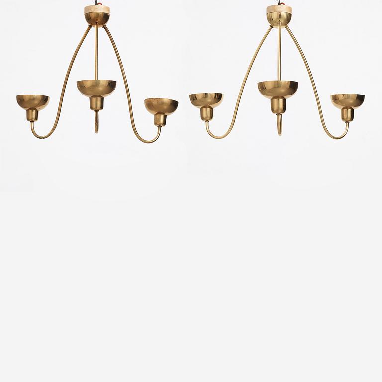 Josef Frank, a pair of three light brass ceiling lamps, model 'G2557', Svenskt Tenn, Sweden 1940-1950s.