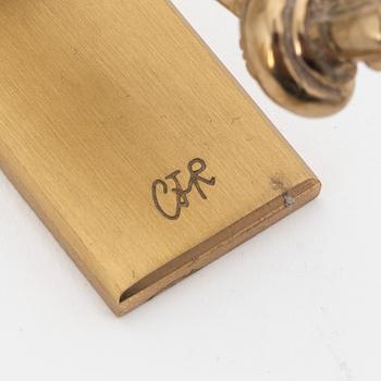 Carl Fredrik Reuterswärd, a brass 'Non violence' sculpture from Skultuna, signed.