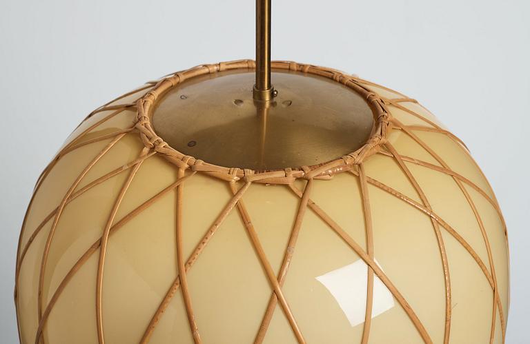 A pair of Swedish Modern vanilla coloured glass ceiling lights with fretted rattan, 1930-40's.