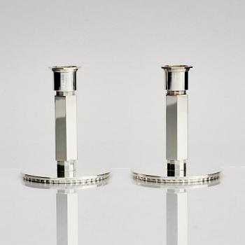 Wiwen Nilsson, a pair of sterling silver candlesticks, Lund, Sweden 11957 and 1960.