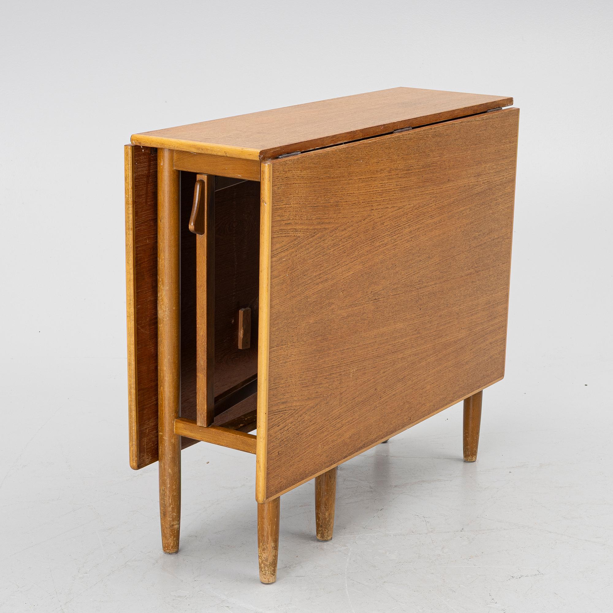 A mid20th century gate-leg table.