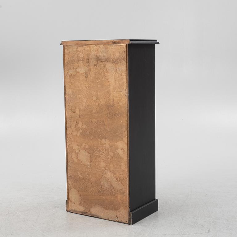 A carved and painted chest of drawers, late 20th Century.