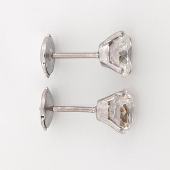 A pair of solitaire dbrilliant-cut diamond earrings. Total carat weight circa 4.20 cts.