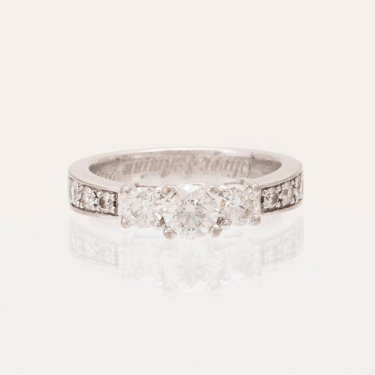 An 18K white gold ring set with round brilliant cut diamonds.