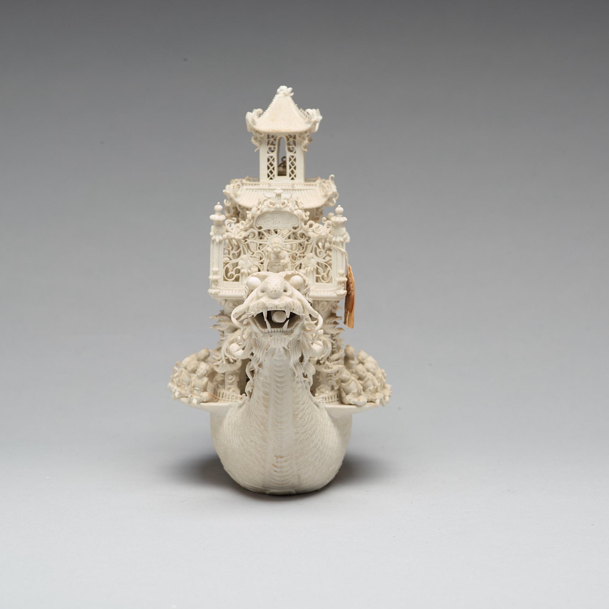 A biscuit porcelain dragon boat of 'Assembly of Immortals', Qing dynasty, Daoguang, signed Chen Guozhi, 19th century.