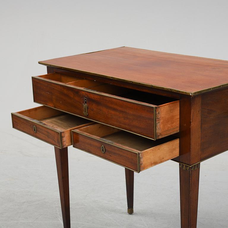 A late Gustavian mahogany tabld with drawers, end of the 18th Century.