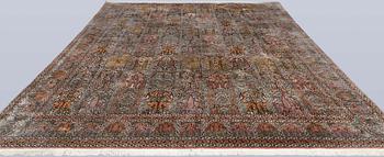 A Kashmir silk carpet, 418 x 297 cm.