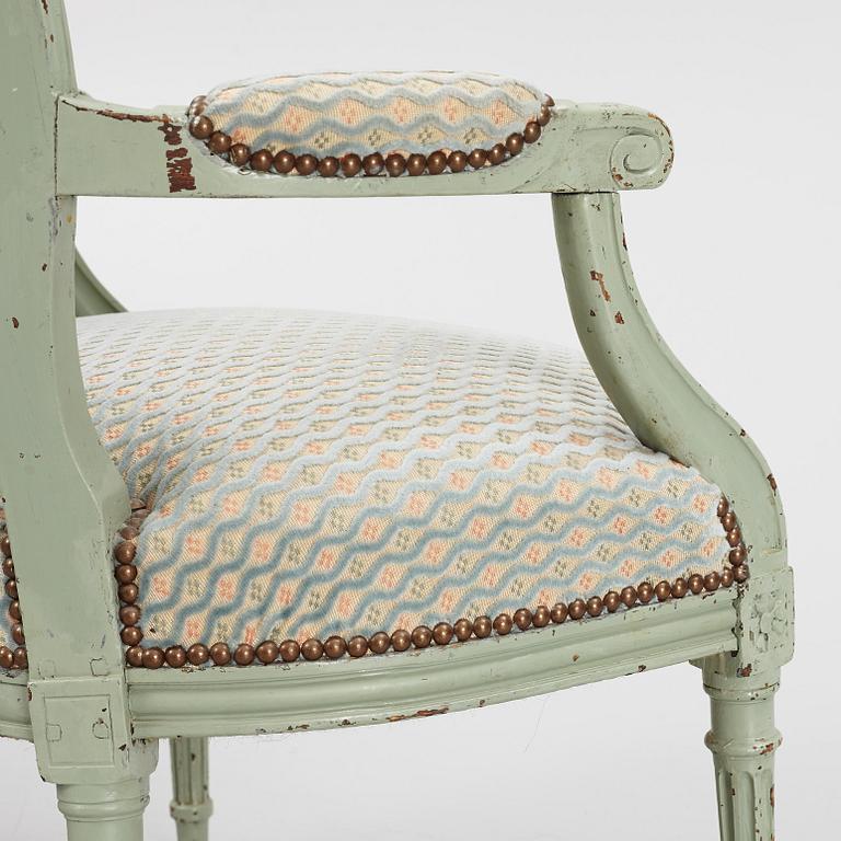 A pair of French Louis XVI open armchairs, late 18th century.