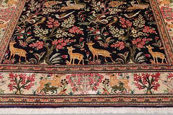 A silk Ghom rug, 155 x 100 cm.