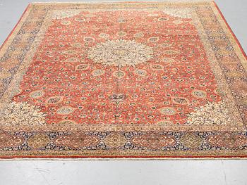 A carpet, semi-antique Tabriz, ca 398 x 290 cm.