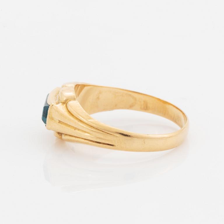 18K gold and greenblue stone ring.