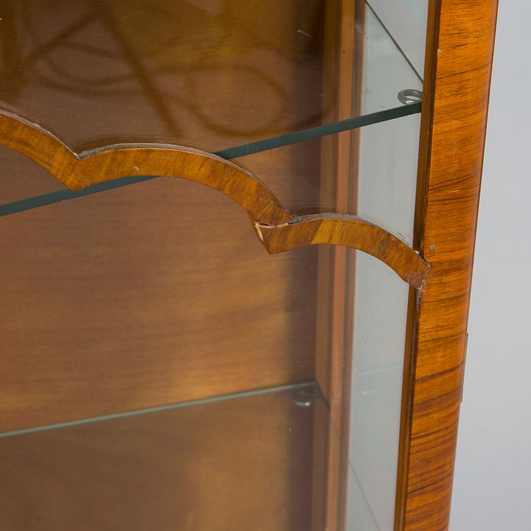 A 1940s display cabinet, England.