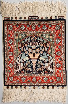 Four silk rugs/pads, probably Hereke, ca 33 x 33 cm.
