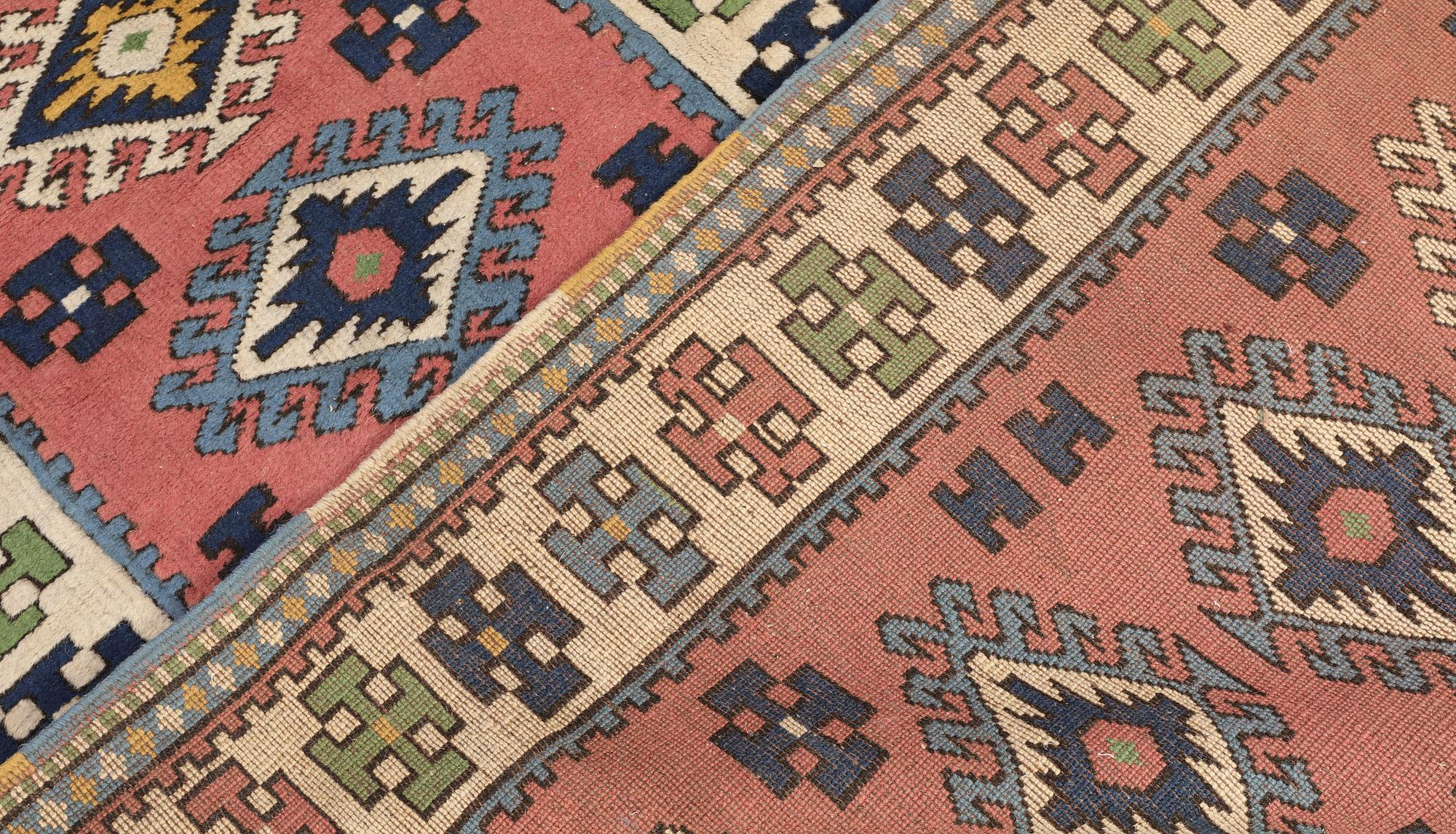 A semi-antique Kars runner, approx. 431 x 95 cm.