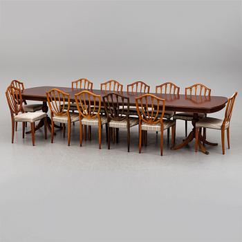 A dining table and 12 chairs, second half of the 20th century.