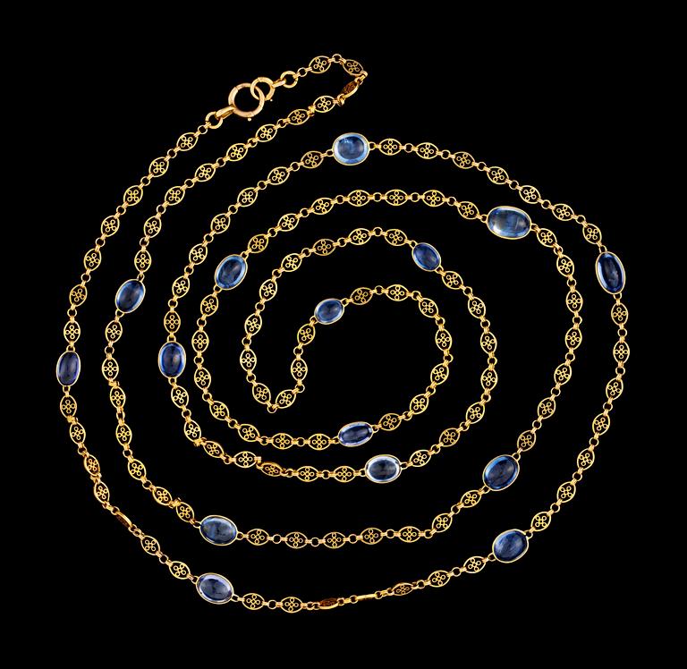 A long gold and blue sapphire chain.