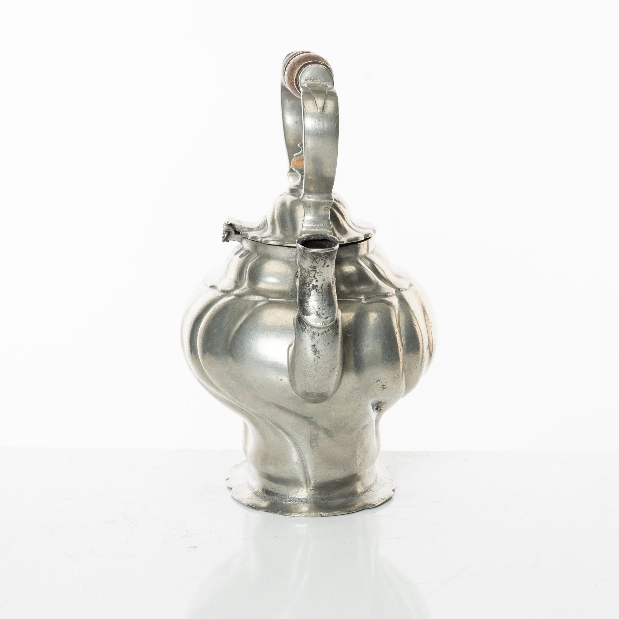 A Rococo pewter teapotby P J Mattsson 1808.