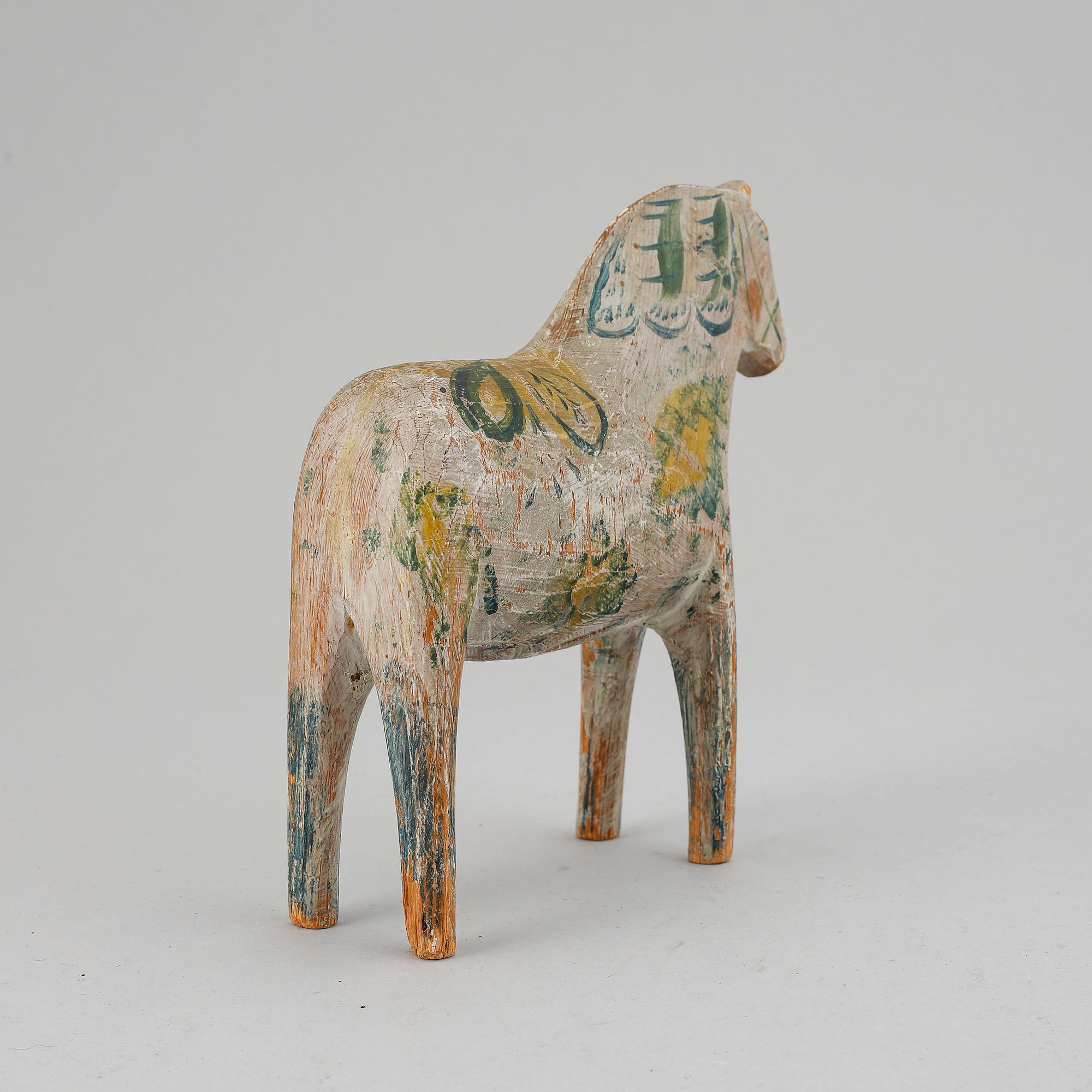 A painted Swedish wooden horse from around year 1900.