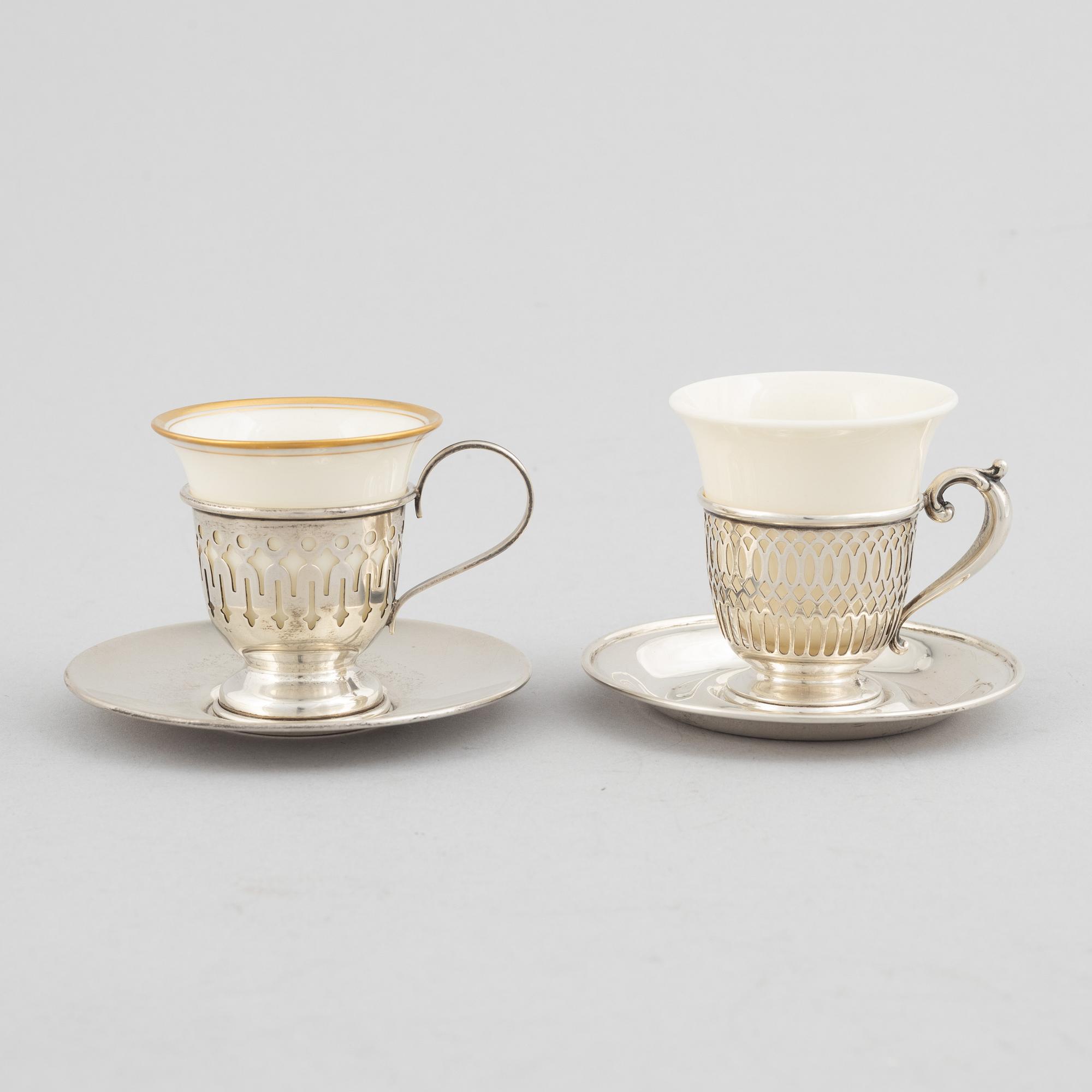 Kopphållare med fat, 6+6 st, sterlingsilver och porslin, bl.a. John Wanamaker, Philidelphia, USA, tidigt 1900-tal.