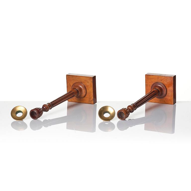A pair of George III mahogany candlesticks, circa 1800.