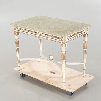 A late gustavian style table, around the year 1900.