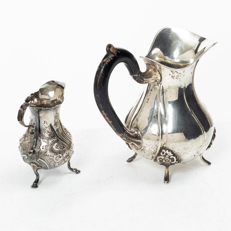 Two silver jugs, one English.
