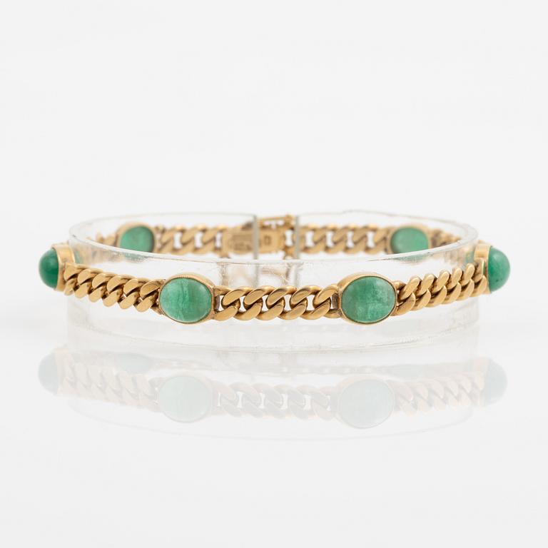 Bracelet in 18K gold with cabochon-cut emeralds, 1920s.