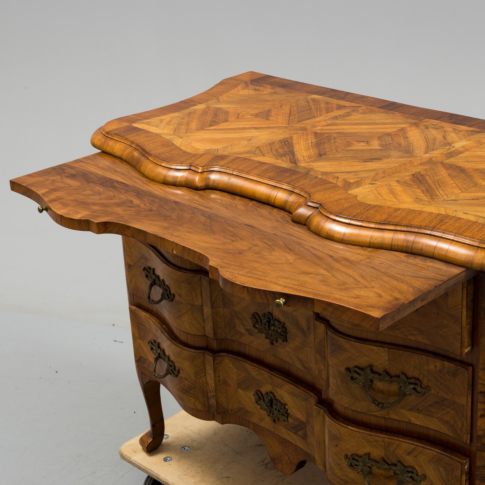A late baroque mid 18th century chest of drawers by Christian Linning.