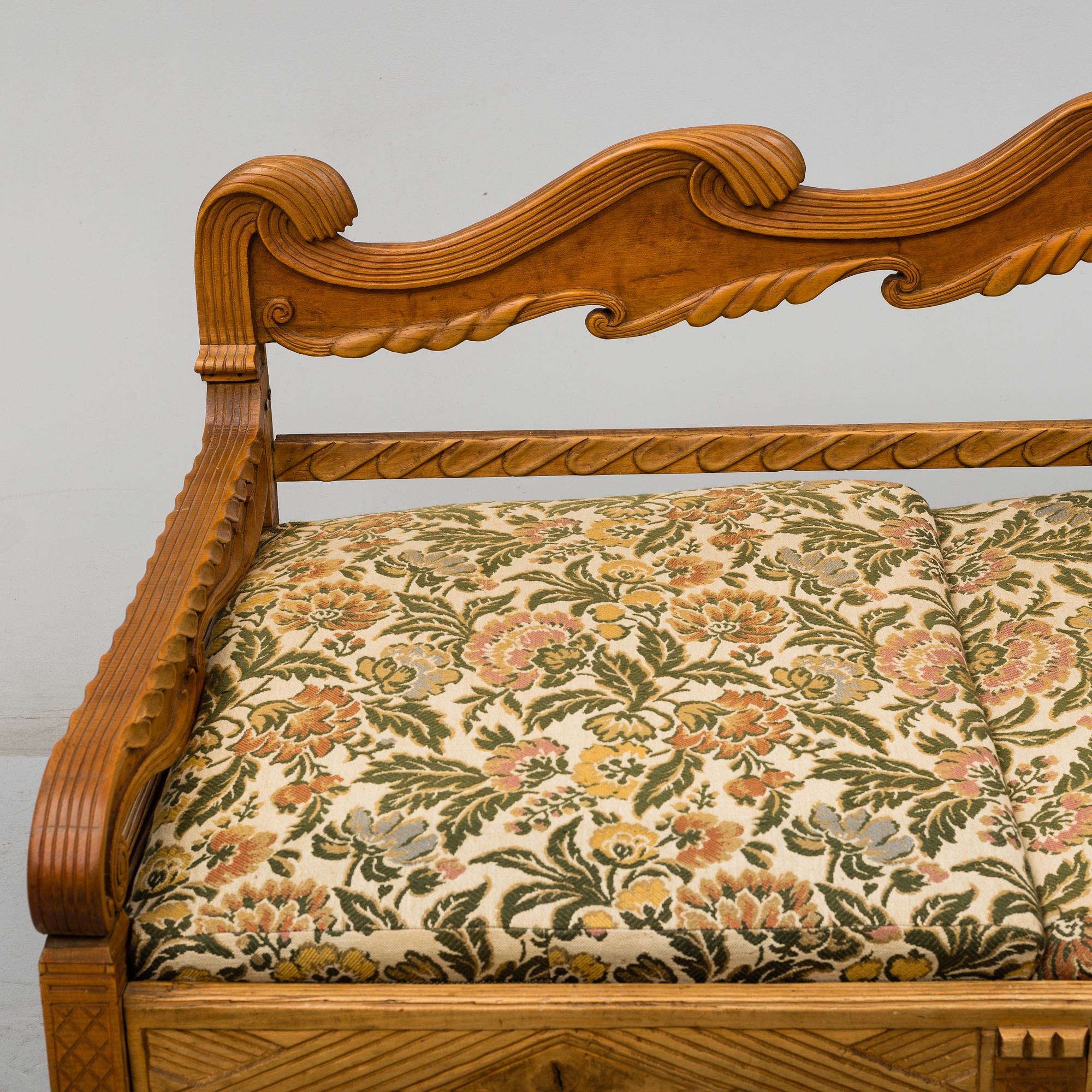 KNUT FJAESTAD, a folk art stained wood sofa/bed,  Sweden, early 20th C.