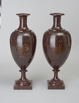 A near pair of Swedish Empire circa 1830 large porphyry urns.