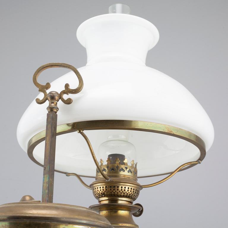 A table paraffin lamp, marked "Kosmos Brenner", around year 1900.