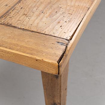 A contemporary French country style dining table.