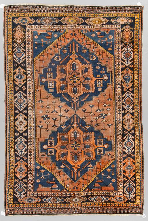 An oriental carpet, around 278 x 182 cm.